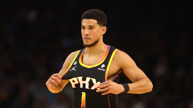Phoenix Suns guard Devin Booker looks on during a game.